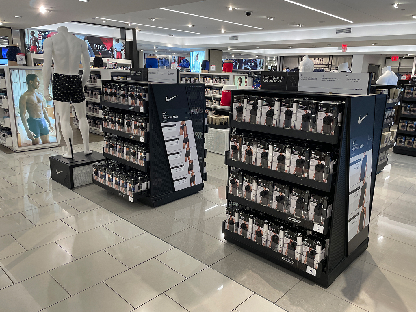 Custom underwear display with tiered shelving and sleek black frame